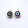Detailed view of evil eye enamel charms in blue and gold for DIY jewelry making - I-1 (Round Loop - Black Yellow Blue)
