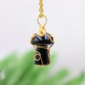 Macro detail of handmade wire-wrapped black crystal mushroom pendant on gold chain - Black Agate Gold Plated