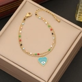 Detail view of a gold double-layer chain with colorful beads and a blue evil eye heart charm - 2# Bracelet