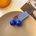 Cute purple elastic hair tie for girls featuring two large blue beads and purple label - Dark Blue