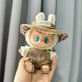 Labubu plush doll in khaki bucket hat and brown overalls with green ears detail - Brown-green Pocket Straps + Bucket Hat / First And Second Generation Keychains Are Compatible With La Cloth Dolls. Dolls Not Included.