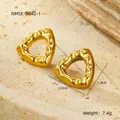 Detailed macro view of gold plated hollow triangle earrings with a textured hammer finish - Lava Texture Hollow Triangle Earrings (NMSE-D842-1)