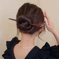 Elegant dark brown wooden hair stick with leaf carvings in a classic updo hairstyle - 10# Hair Stick - Dark Brown Leaf