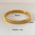 Detailed view of 58mm gold elastic spring bracelet with 8mm width and 13g weight specifications - 8mm Gold