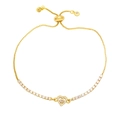 Close-up of golden bolo bracelet with pink heart gemstone and sparkling pavé zircon stones - Pink