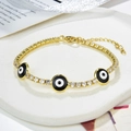 Bracciale tennis dorato con zirconi e ciondoli occhio del male nero su vassoio - Oro-Occhio del Diavolo Nero