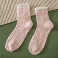 Detail of coral fleece slipper socks featuring non-slip grippers and soft white trim - One Size / Spliced Light Pink