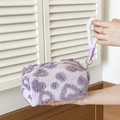 Purple plush cosmetic bag with heart-shaped textures and a convenient carrying handle - Handheld Plush Purple Heart
