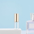 Clear glass roller bottle for perfume and essential oil with gold cylindrical cap - 3ml Gold
