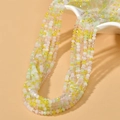 Close-up of 3mm colorful faceted glass beads in yellow and green for DIY jewelry making - Transparent Yellow Color