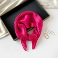 Detailed close-up of a pleated rose pink silk scarf elegantly folded on a black tray - 70*70cm / Pleated Rose Red