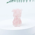 Pink quartz mini schnauzer dog crystal statue displayed on a white podium - 22 Rose Quartz