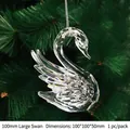Macro detail of a 100mm faceted crystal swan pendant hanging on a green festive tree - 100mm Large Swan