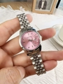 Close-up of a silver mesh steel watch for women with pink dial and calendar date window - Pink