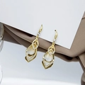 Detailed close-up of golden teardrop earrings with crystals and white opal stones on silk - Gold Layered Waterdrop Gemstone Earrings (E4395)