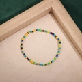 Detailed close-up of colorful handmade seed bead bracelet on beige textured fabric - Style 27-Multicolor Bohemian Seed Beads