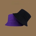 Flat lay of black and purple reversible sun hats with wide brims and UV protection - M (56-58cm) / Deep Purple & Black