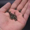 Dark grey metallic seed beads held in hand for DIY jewelry making accessories - 4mm / 15g / Gunmetal