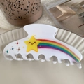 White acetate hair claw clip with a smiling yellow star and rainbow rhinestone pattern - Rainbow Star / White
