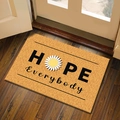 Rectangle coconut-style entryway doormat with HOPE Everybody daisy text on wood floor - HOPE / 60*90cm