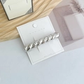 Elegant silver twisted rope texture metal spring hair clip displayed on card - Small Twisted Silver