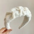 Soft white chunky knit headband with a twisted braid texture for a stylish winter look - Off White