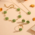 Gouden roestvrijstalen sieradenset met groene kattenoogbloemen, ketting en oorbellen - Groene Kattenoog Set