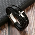 Dettaglio del bracciale multistrato in pelle nera intrecciata con ciondolo a battito cardiaco - Nero + Acciaio Argento