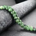 Polished natural Ruby in Zoisite round beads on black display stand for DIY jewelry - Ruby Zoisite