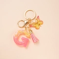 Pink gradient glitter Letter G keychain with butterfly and tassel on gold hardware - Letter G
