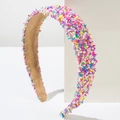 Detailed macro view of colorful sprinkle patterns on this wide minimalist headband - Purple Multi