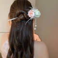Pink and green flower hairpin with pearl tassels shown on a model's elegant bun hairstyle - Pink Green Feather Tassel Style (140#)