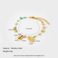 Macro view of ocean style stainless steel bracelet with sea shells and colorful stones - Bracelet (DFB204)