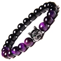 Macro shot of tiger eye beads bracelet with zircon-inlaid metal wolf head detail - Purple Tiger Eye