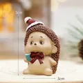 Miniature Christmas hedgehog resin figurine with red hat and blue cup, 5cm height - Christmas Hedgehog Style(24958)