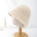 Close-up of beige knit bucket hat showing thick wool texture and ribbed pattern detail - Adjustable / Off-white