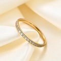 Elegant 2mm gold stainless steel ring with micro-pave crystals on beige silk background - US 4 / Gold