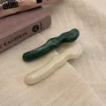 Elegant wavy marble resin hair clips in dark green and cream white with gold metal base - Dark Green Series (2 Pcs)