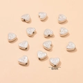 Perline distanziatrici CCB a cuore argento da 6mm con texture per creazione gioielli - Texture a Rilievo / Argento