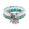Detail of tree of life and leaf charms on four-layer turquoise beaded stretch bracelets - Green Shoushan Stone