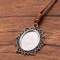 Antique silver oval pendant with ornate lace edge on a brown PU cord necklace - Gorgeous Openwork Lace Style