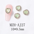 Detailed view of light green cat eye heart nail charm with sparkling rhinestone gold base - Gold Base Light Green Opal (AJ27)