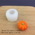 Detail view of 3D pumpkin silicone mold with finished orange resin model on wood board - 3D Small Pumpkin