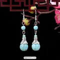 Ethnic vintage turquoise drop earrings with silver flower caps, approx. 4x1.1cm - 10-Simple Round Bead