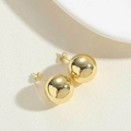 Macro shot of 14K gold-plated ball stud earrings with a high-polished mirror finish - Small / Gold