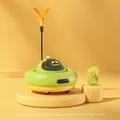 UFO-shaped electric cat toy in green and yellow with remote control and orange feather - Tian Green Remote Control