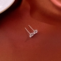 Close-up of minimalist silver stud earrings with sparkling cubic zirconia on silk - 6mm Zircon (925 Silver Pin)