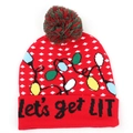 Close-up of 'let's get LIT' text on a red Christmas pom-pom beanie with snowflake motifs - Red Base Colorful Light Bulbs 'LIT' Text Jacquard Style (C#)