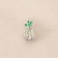 Detailed view of silver pineapple pendant with green and yellow zircons on fabric - Silver (Colorful Pineapple)
