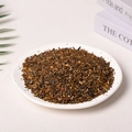 Natural brown crystal crushed stone fragments presented in a white ceramic dish - Tiger Eye Stone (3-5mm) 100g